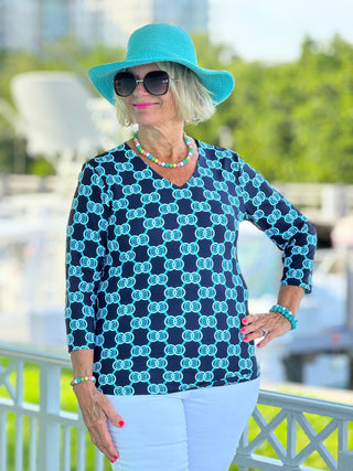 BLUE MEDALLION V NECK TOP